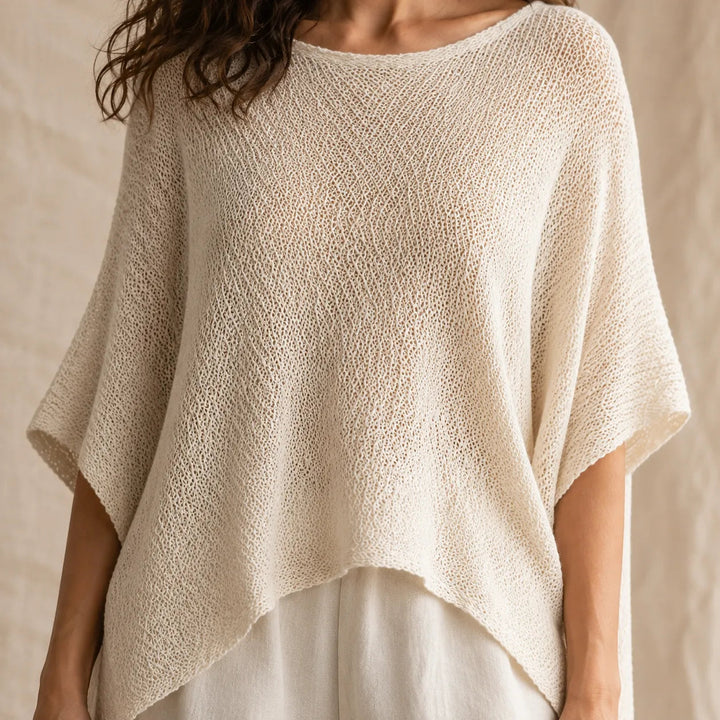 Solvera – Open Knit Batwing Top with Asymmetric Hem