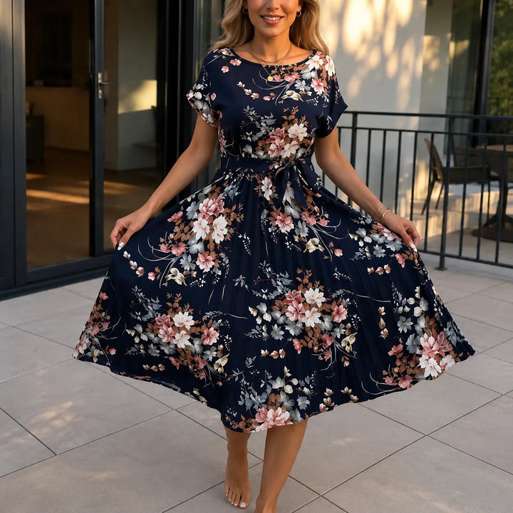 Florenza – Floral Pleated Midi Dress with Tie Waist and Flutter Sleeves